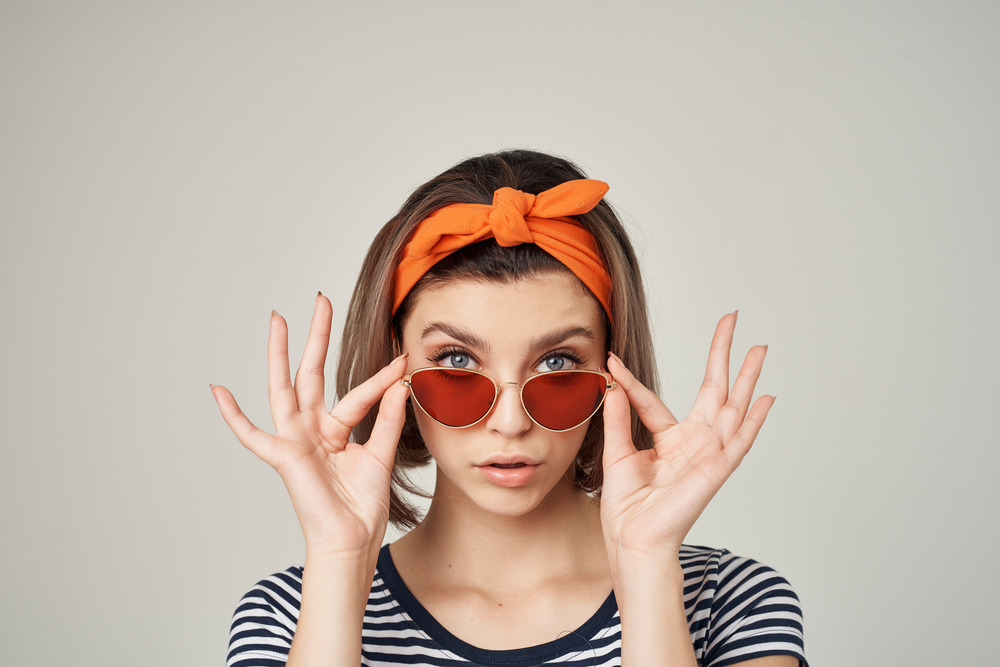 Photo of a woman with great skin wearing sunglasses