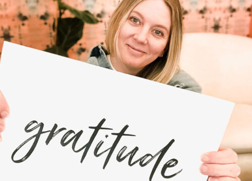 Beth holding up a sign that says 