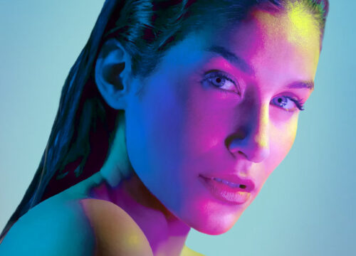 Woman with smooth skin after Letybo injections on a blue background